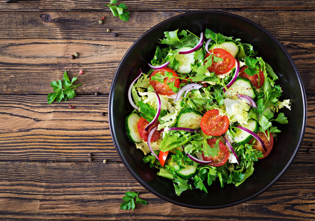 salad-from-tomatoes-cucumber-red-onions-lettuce-leaves-healthy-summer-vitamin-menu-vegan-vegetable-food-vegetarian-dinner-table-top-view-flat-lay