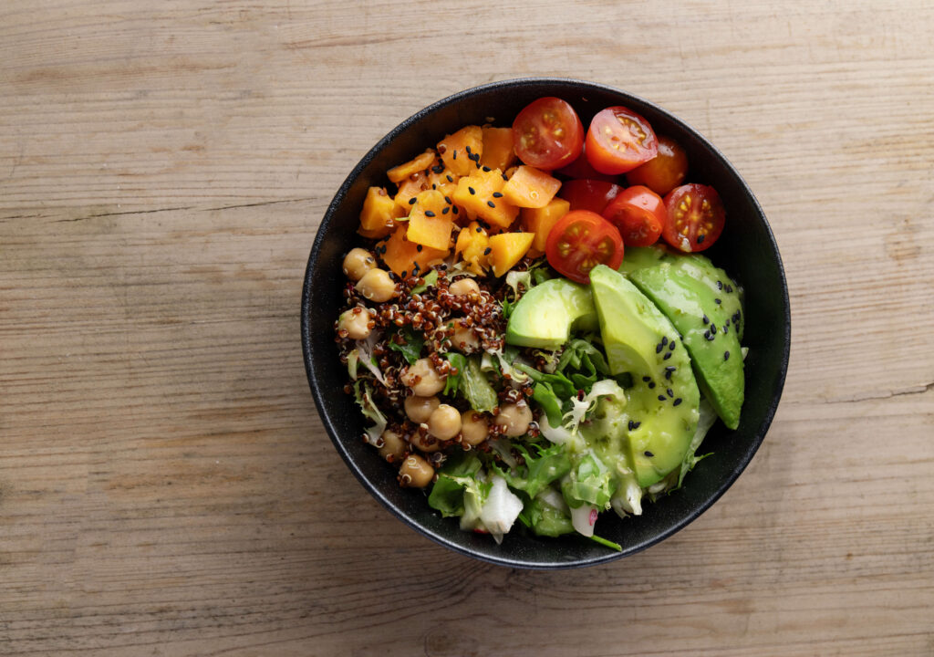 tasty-fresh-poke-bowl-with-avocado-quinoa-vegetables-top-view